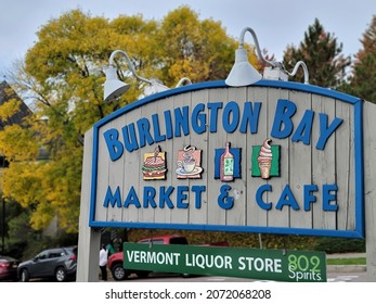 Burlington Vermont USA - October 11 2021 : Sign Of Burlington Bay Market And Café With Brilliant Autumn Tree In The Background 