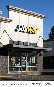 Burlington, WA, USA - February 12, 2022; Frontage Of Subway Sandwich Store In Burlington Washington With Logo Name Above Entrance Door