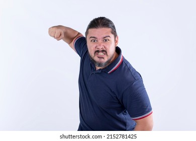 A burly and stocky man threatens to punch an enemy. Insulted and pissed off. In a threatening and hostile posture.