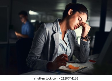 Burn Out, Not Good For You Nor The Business. Cropped Shot Of A Young Attractive Businesswoman Working Late At Night In The Office.