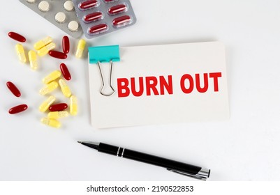 BURN OUT Text Written In Card With Pills. Medical Concept.