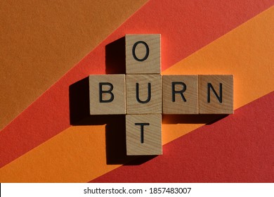 Burn Out, words in wooden alphabet letters in crossword form isolated on colourful background
