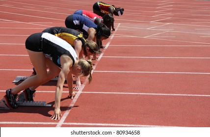 BURNABY, CANADA - JULY 9: Unidentified Girls On The Start Of The 100 Meters Dash On The 24th Annual Trevor Craven Memorial Track & Field Meet On July 9, 2011 - Swangard Stadium, Burnaby, Canada