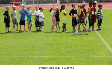 BURNABY, CANADA - JULY 9: Unidentified Children On Fun Run On The  On The 24th Annual Trevor Craven Memorial Track & Field Meet On July 9, 2011 At Swangard Stadium In Burnaby, Canada