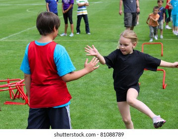 BURNABY, CANADA - JULY 9: Unidentified Children On Fun Run On The  On The 24th Annual Trevor Craven Memorial Track & Field Meet On July 9, 2011 At Swangard Stadium In Burnaby, Canada