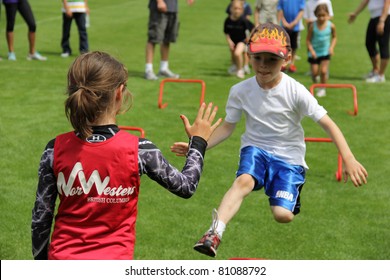 BURNABY, CANADA - JULY 9: Unidentified Children On Fun Run On The  On The 24th Annual Trevor Craven Memorial Track & Field Meet On July 9, 2011 At Swangard Stadium In Burnaby, Canada