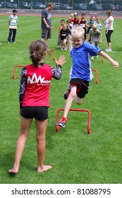 BURNABY, CANADA - JULY 9: Unidentified Children On Fun Run On The  On The 24th Annual Trevor Craven Memorial Track & Field Meet On July 9, 2011 At Swangard Stadium In Burnaby, Canada