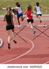 BURNABY, CANADA - JULY 9: Unidentified Girls Are In The 200-meters Hurdles On The 24th Annual Trevor Craven Memorial Track & Field Meet On July 9, 2011 At Swangard Stadium In Burnaby, Canada