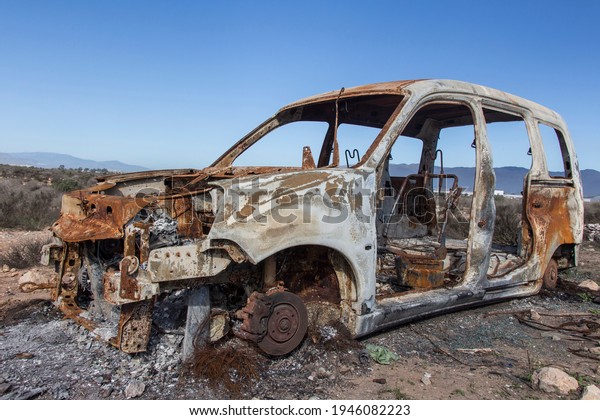 burned car\
abandoned, car destroyed bo fire, mini\
van