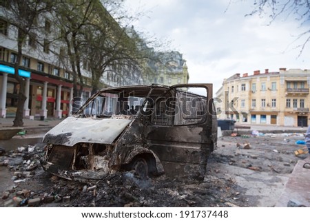 Burned car in the center of city after unrest in Odesa, Ukraine 