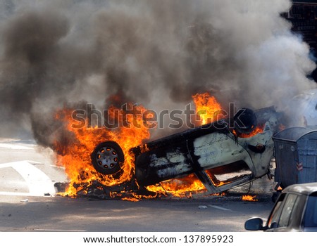 Burned car during street riots