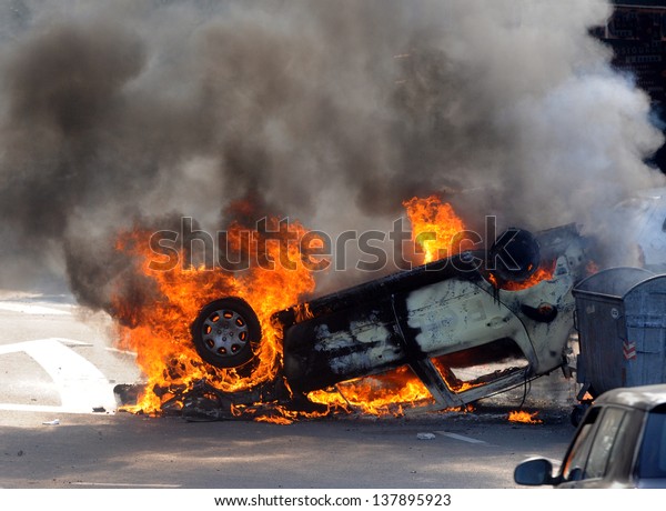 Burned car during street\
riots