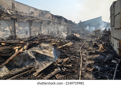 Burned And Damaged Industrial Complex. Burned Factory. Remnants Of Burnt Down Building. Fire Damage. Damaged Industrial Halls.