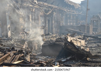 Burned and damaged industrial complex. Burned factory. Remnants of burnt down building. Fire damage. Damaged industrial halls.	