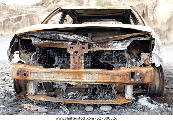 burned down car wreck -\
damaged car