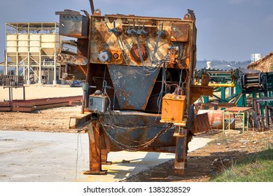 Burned Down And Rusty Industrial Machine Under Heavy Sunlight - Shutterstock ID 1383238529