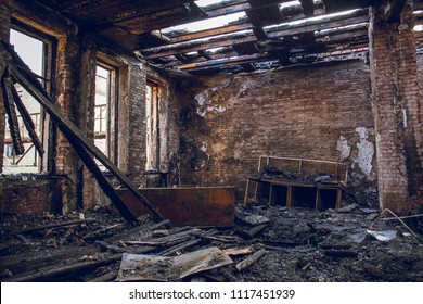 Burned house interior after fire, ruined building room inside, disaster or war aftermath concept