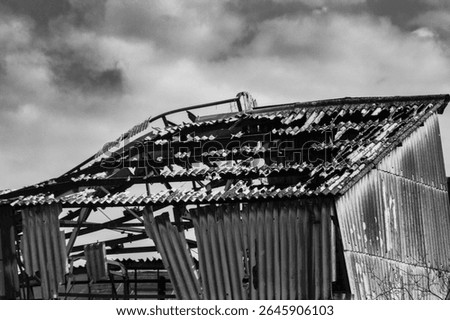 Burned out building with dramatic sky