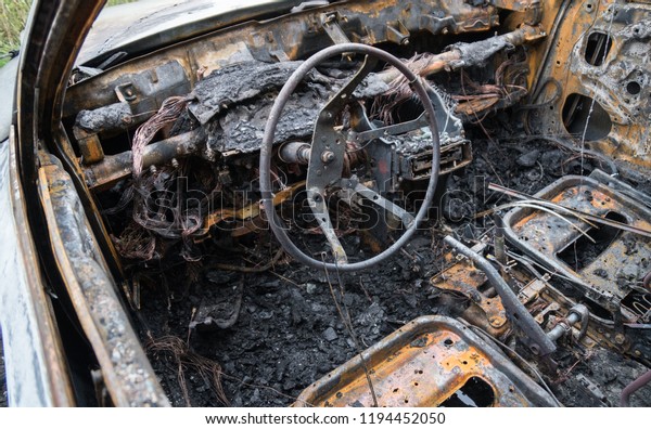 Burned out car\
after a car accident. Inside\
view.