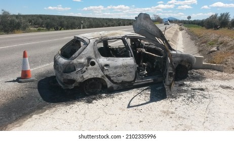 Burned Peugeot vehicle after a traffic accident 