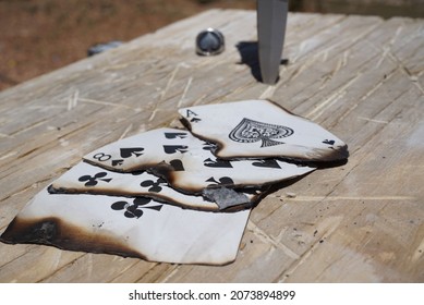 A burned set of cards showing a hand known as "Dead Man's Hand"