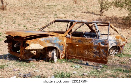 the burned-down car - Shutterstock ID 323117504