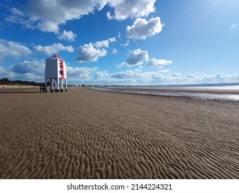 Burnham-on-sea Lighthouse With Sandy Beach, Blue Sky And Clouds.  Ultra Wide Shot.