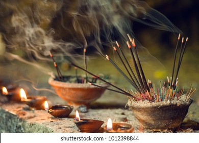 Burning aromatic incense sticks. Incense for praying Buddha or Hindu gods to show respect. - Powered by Shutterstock