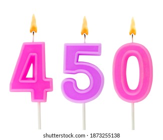 Burning birthday candles isolated on white background, number 450