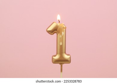 Burning birthday candles on pink background, number 1 - Powered by Shutterstock