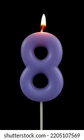 Burning Blue Birthday Candle Isolated On Black Background, Number 8