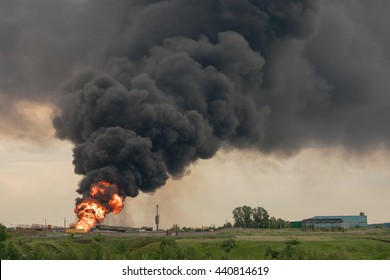 Burning building with flames and black smoke