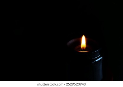 Burning candle dark on black background. Template. copy space. - Powered by Shutterstock