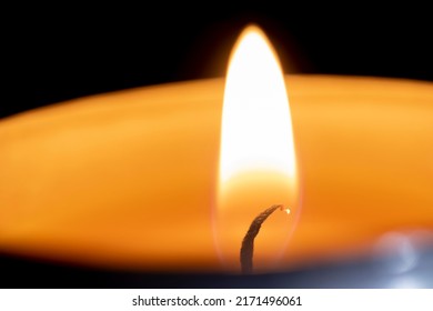 Burning candle flame close up black background - Powered by Shutterstock - Get 15% off with code: PIKWIZARD15