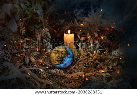 burning candle, moon amulet in dry autumn leaves on dark natural background. pagan, Wiccan, Slavic traditions. Witchcraft, esoteric spiritual practice. magic ritual. witch aesthetic. autumn equinox