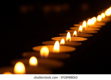 burning candles in the dark - Powered by Shutterstock