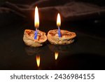 Burning candles on a floating shell, Christmas