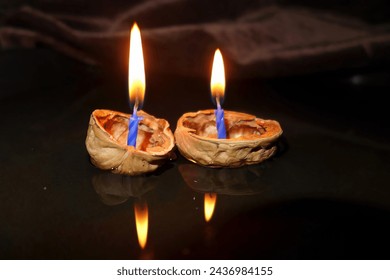Burning candles on a floating shell, Christmas