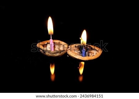 Burning candles on a floating shell, Christmas