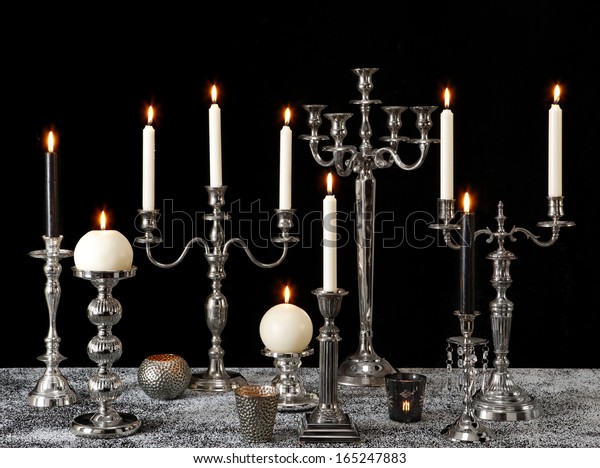 black and silver candle holders