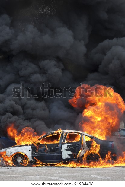 a burning car after\
a serious accident