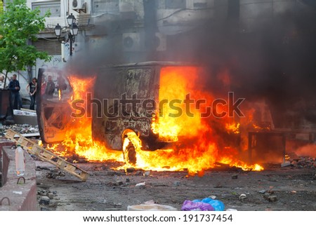 Burning car in the center of city during unrest in Odesa, Ukraine 