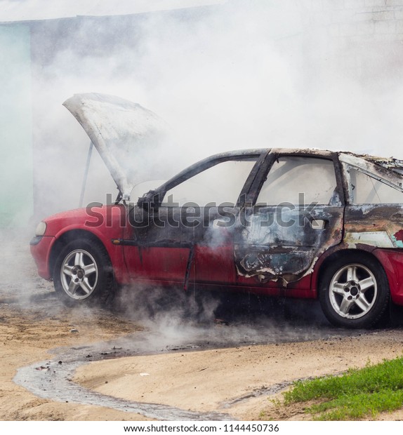 Burning car, lots\
of smoke, fire, short\
circuit
