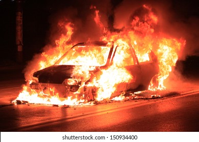 Burning car on the road