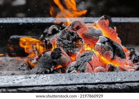 Burning charcoal to burn satay or meat. Hot.