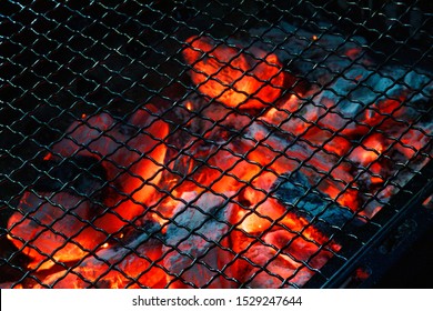 Burning Charcoal Fire And Net