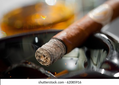 Burning Cigar In Ashtray