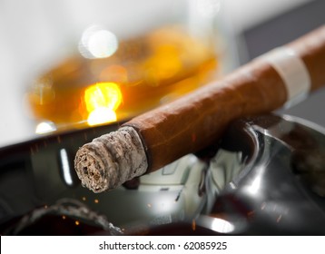 Burning Cigar In Ashtray