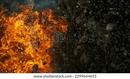 Burning coal with fire, top view shot. Concept of fossil fuel burning.