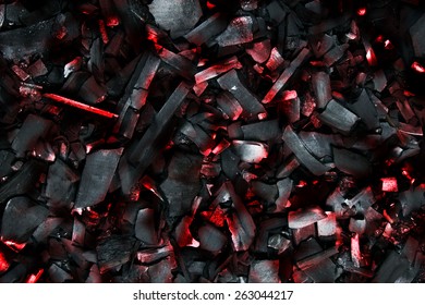 Burning coals. Decaying charcoal. Backround with charcoal.